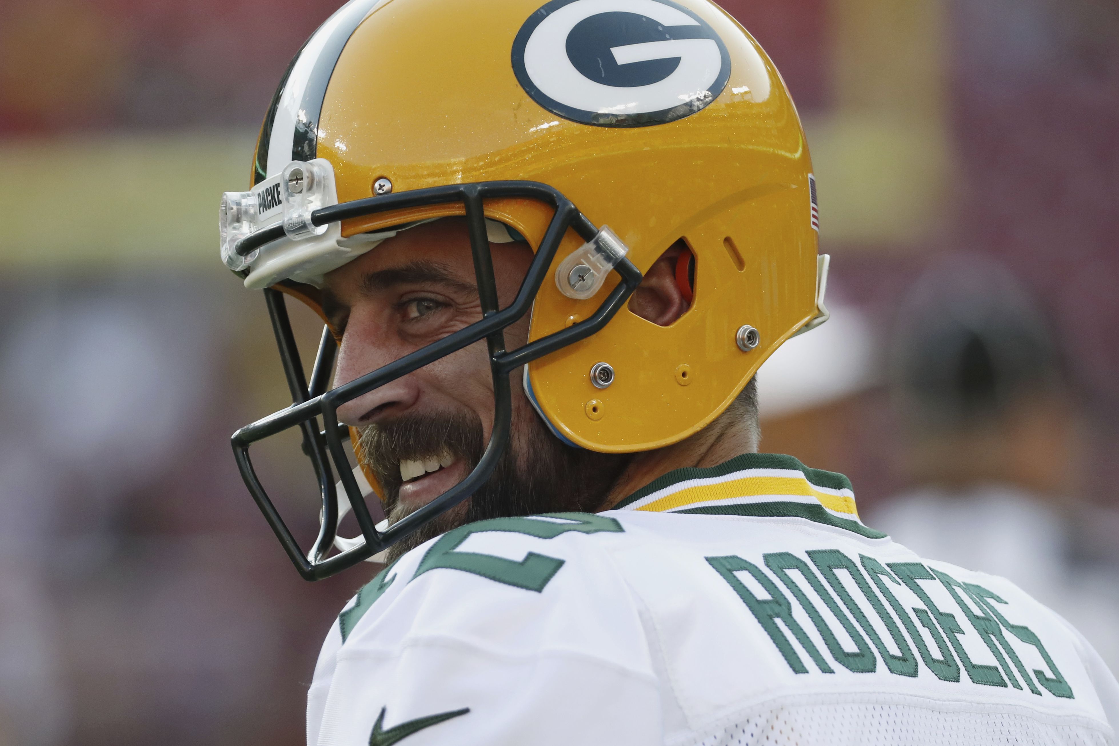 Green Bay Packers quarterback Aaron Rodgers (12) looks to pass the ball  against the Washington …